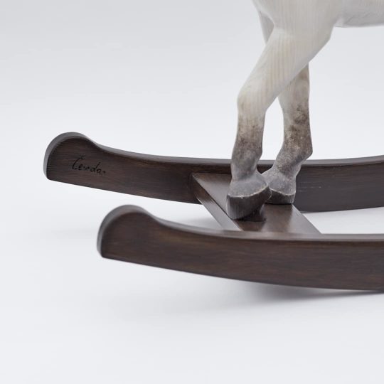 Middle sized wooden rocking horse, white colors