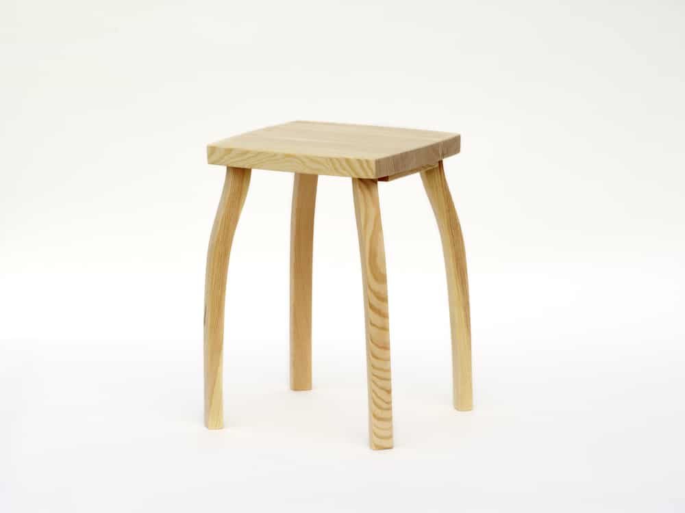 Elegant stool from pinewood, natural surface finish